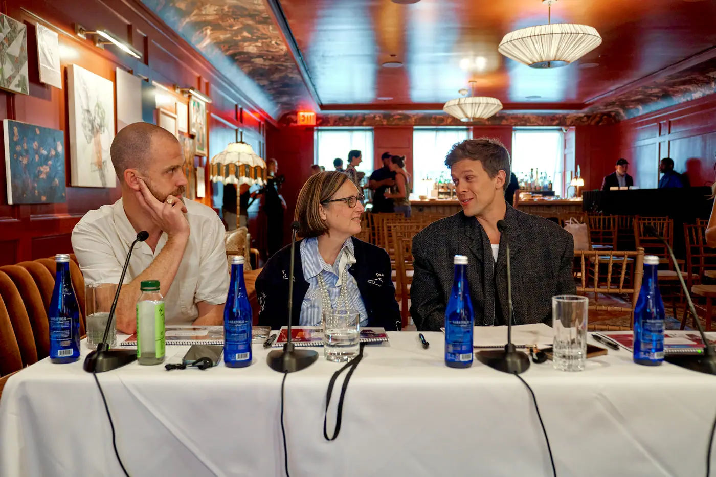 Judges talking at the judging table before the pitches