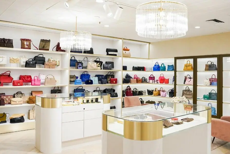 Walls of pre-loved luxury handbags at The Purse Affair