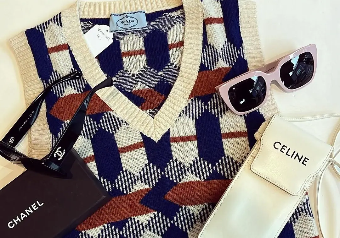 Knitwear, Chanel and Celine pieces laid out at a Melbourne consignment boutique